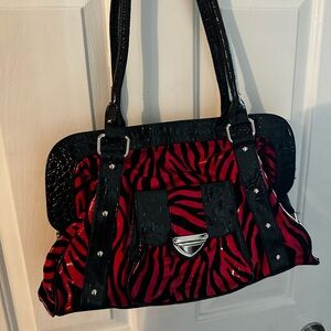 Red and black zebra print purse. Used once. Excellent condition.
